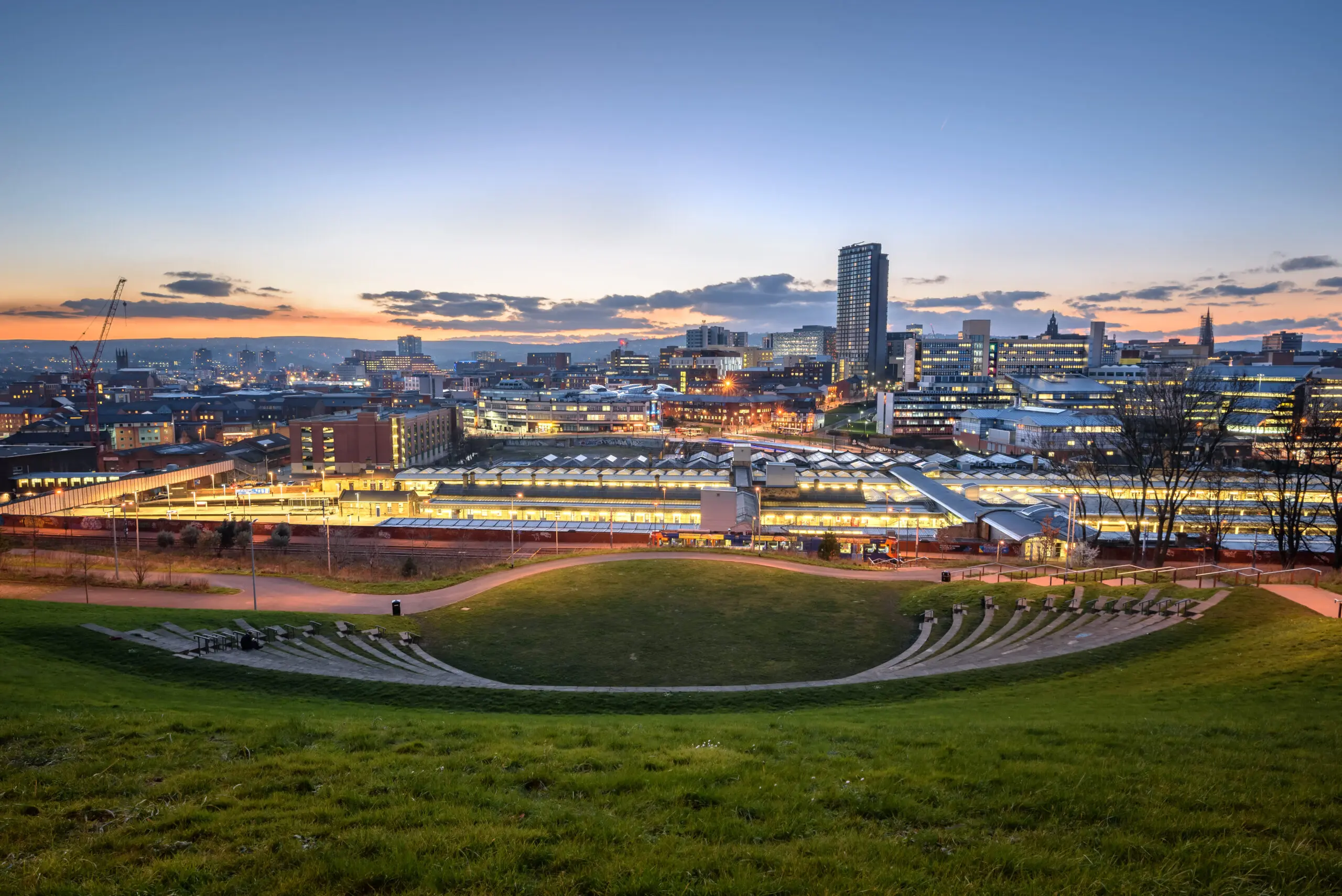 Image of a train station at night in Sheffield where we do Pat Testing