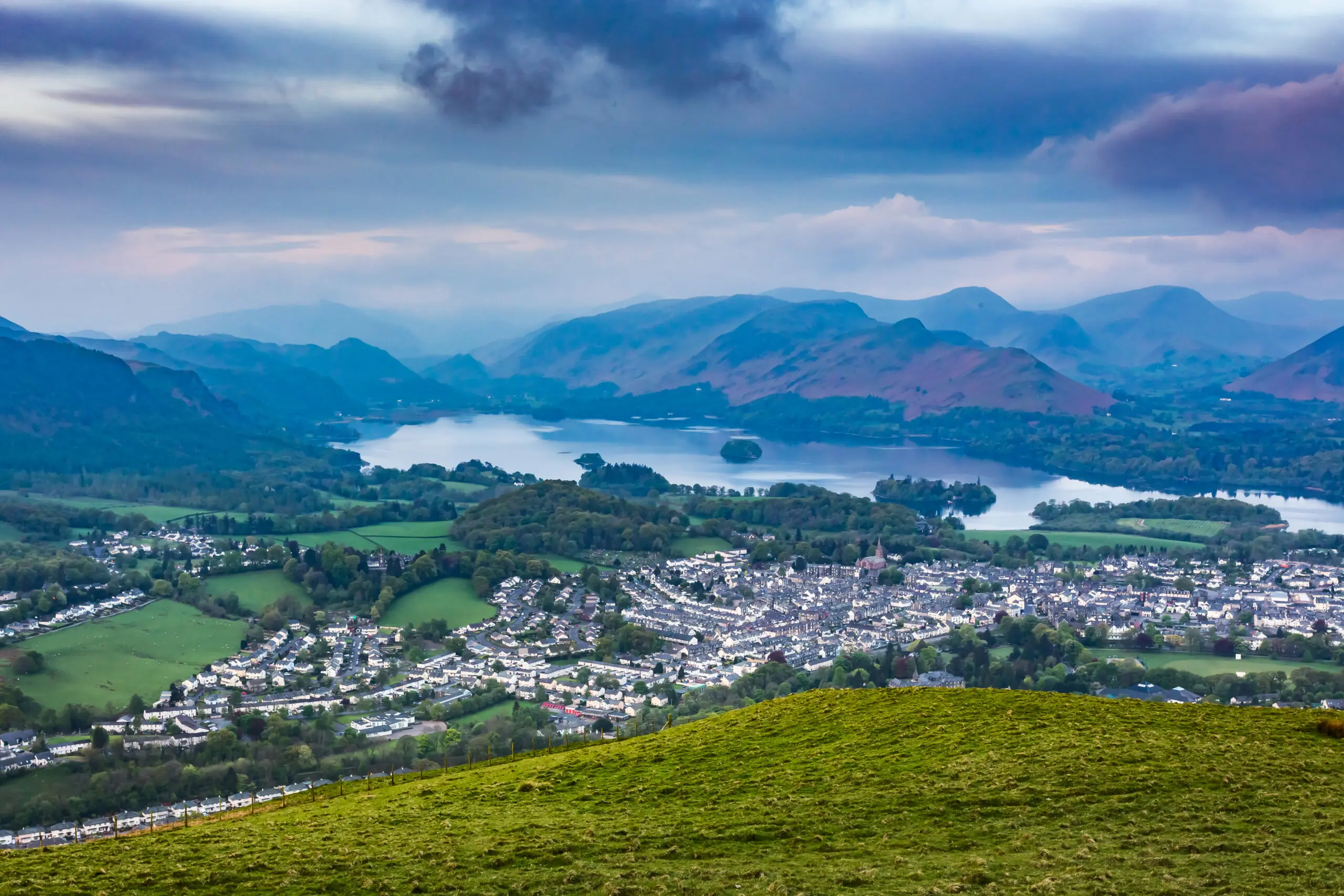 Image of a hill with the village in the distance in Keswick where we provide Pat Testing