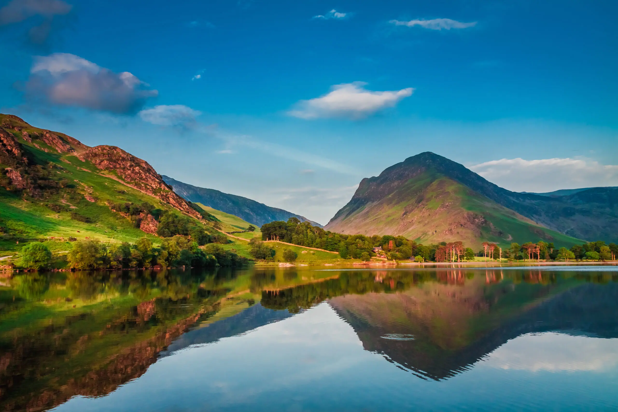 Image of lake surrounded by hills in Cumbria where we provide Pat Testing