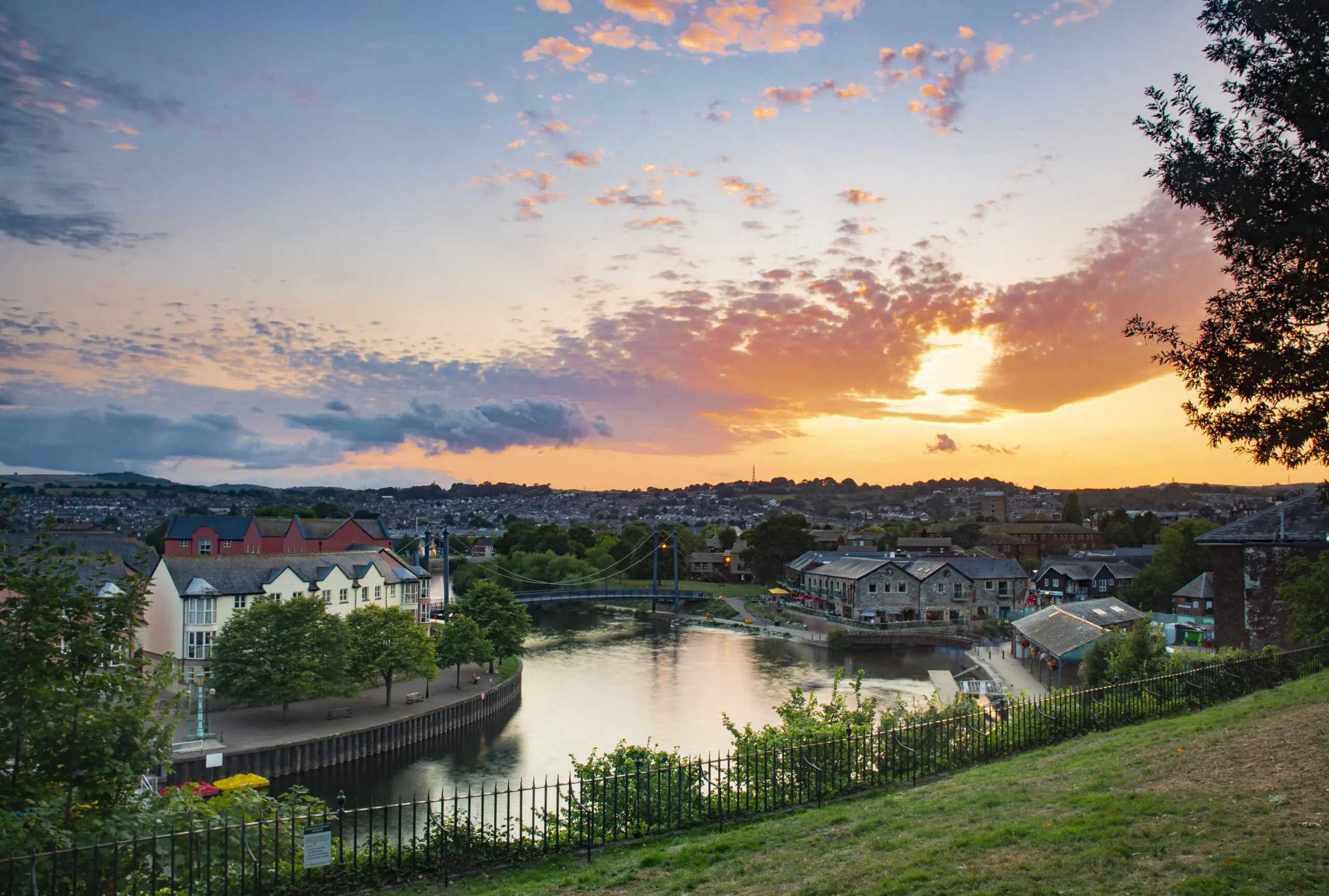 Picture of sun set over a bridge in Exeter where we provide Pat Testing