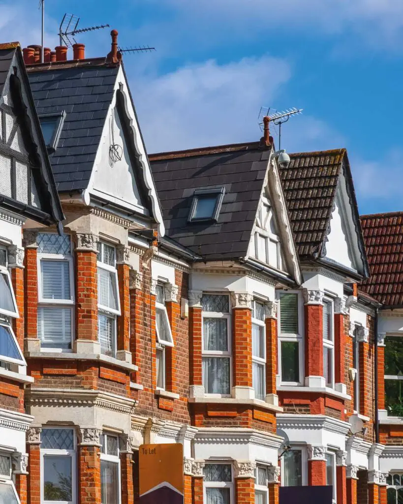 Picture of terraced houses with blue sky behind them