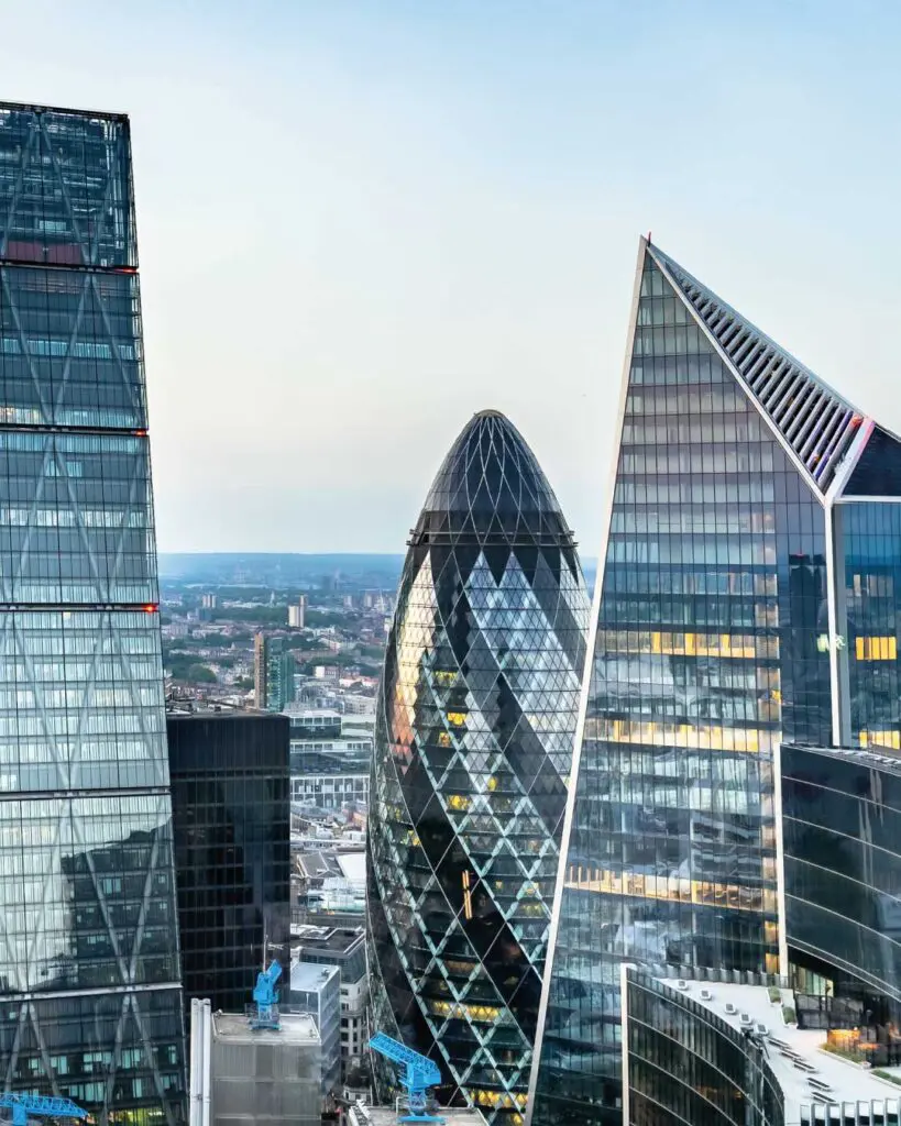 Image of tall glass buildings overlooking a city